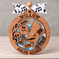 Round wooden color guard shaker ornament with a flag spinner and music notes, beads in school colors, and the name, school, and year