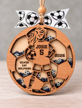 Wooden girls soccer shaker ornament with a ponytailed player holding a ball, personalized with Josie, number 5, Silver Cat Dolphins, and 2026, filled with navy and silver beads and mini soccer balls